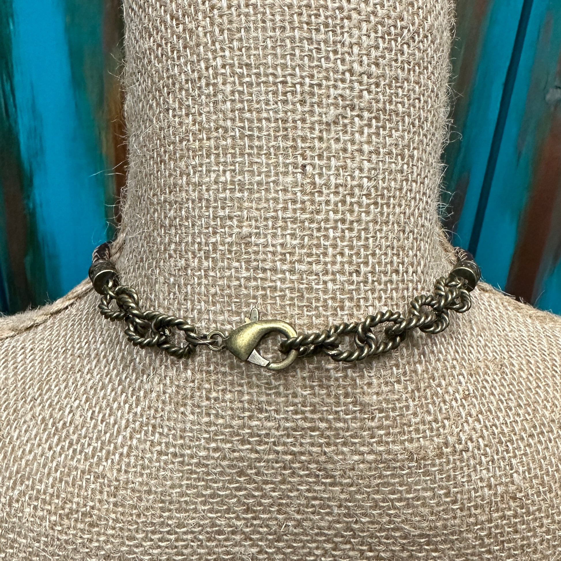 Bronze chain necklace on a mannequin.