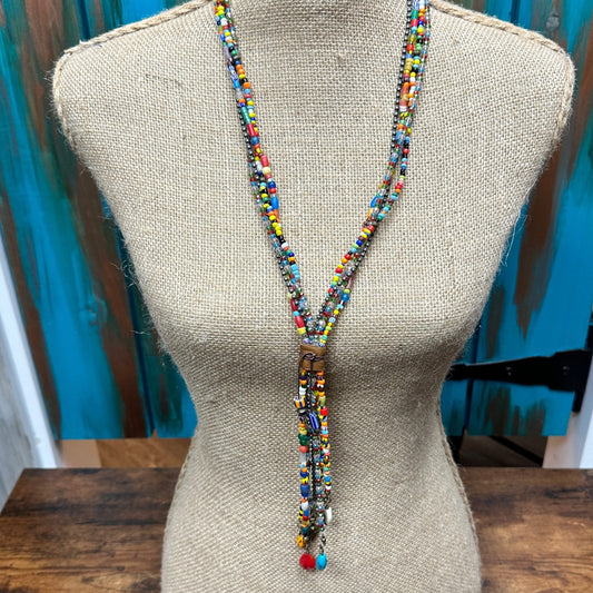 Beaded necklace on a mannequin.