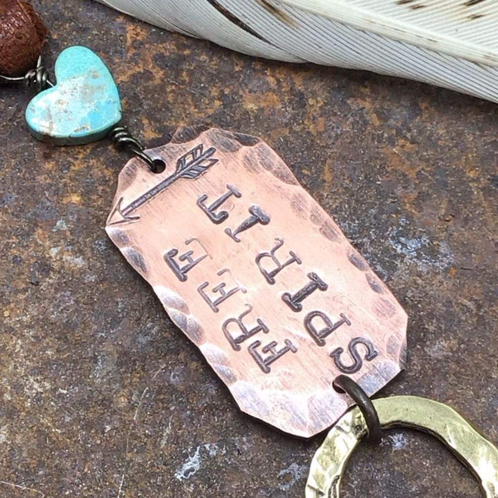 Copper tag with Free Spirit and a turquoise heart charm.
