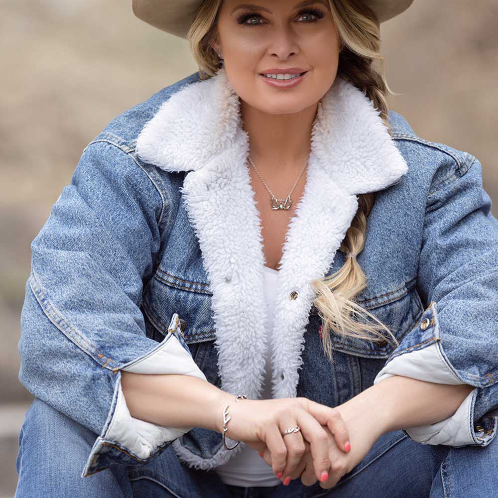 Blonde woman in denim jacket and cowboy hat (KTBC5654)