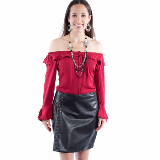 Woman in red off-shoulder top and black leather skirt