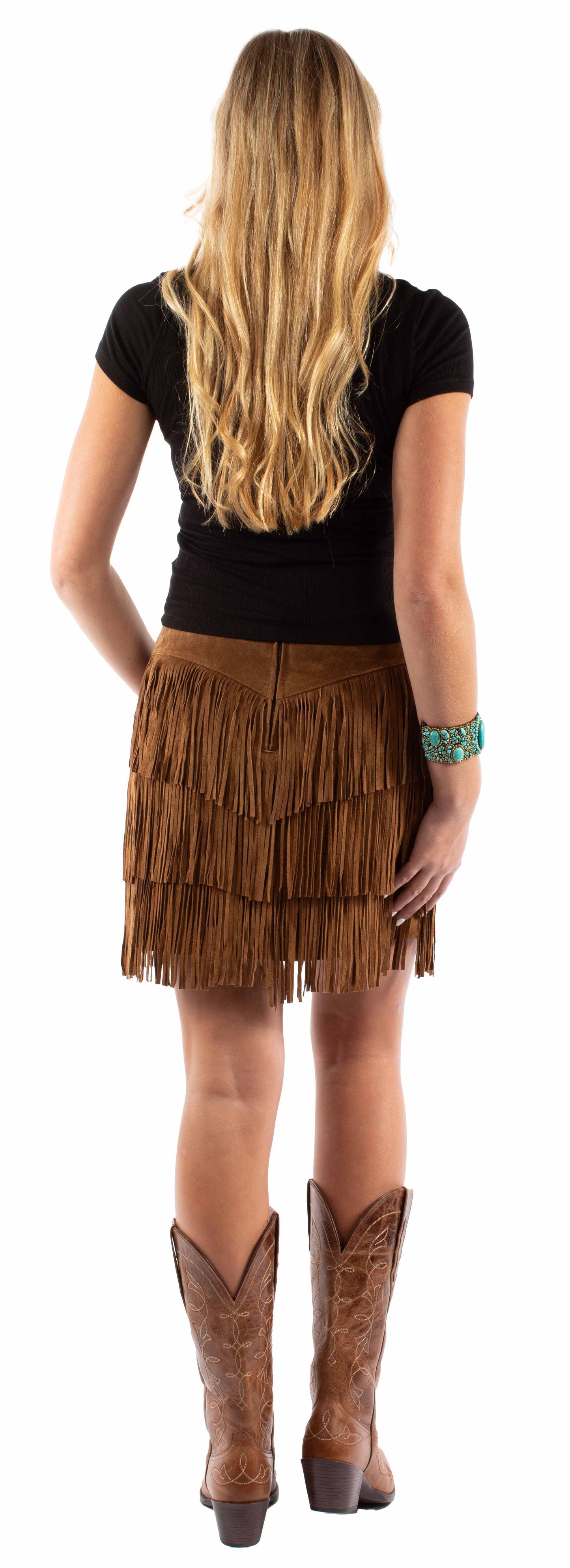 Woman in fringe skirt and boots