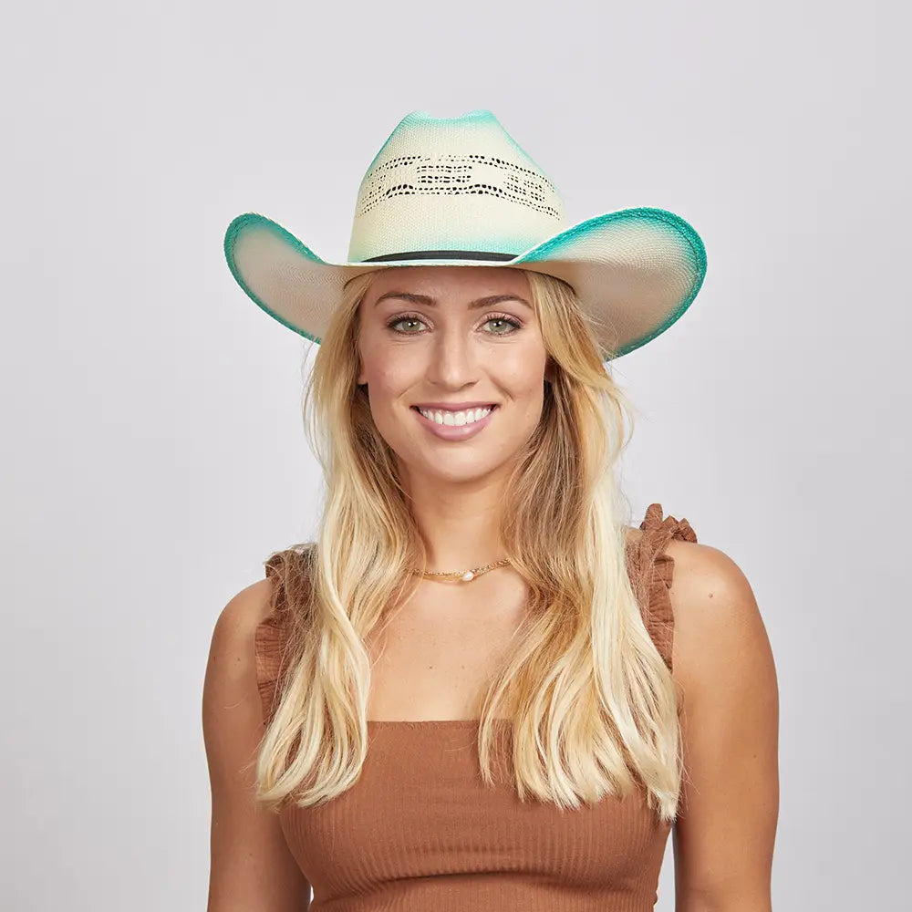 Olivia wearing turquoise straw cowboy hat by American Hat Makers