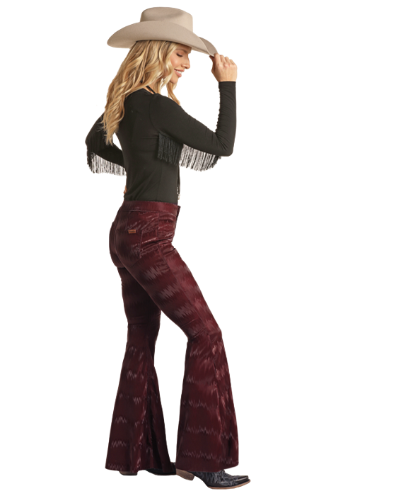 Woman in bell bottoms and cowboy hat