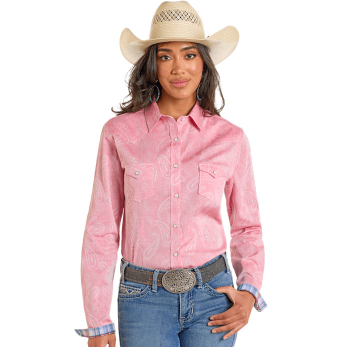 Woman in pink paisley shirt and cowboy hat