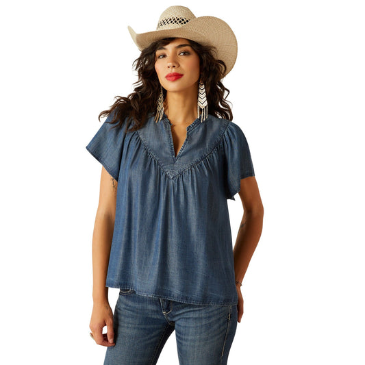 Woman in denim top and S25 WMS WEST shirt