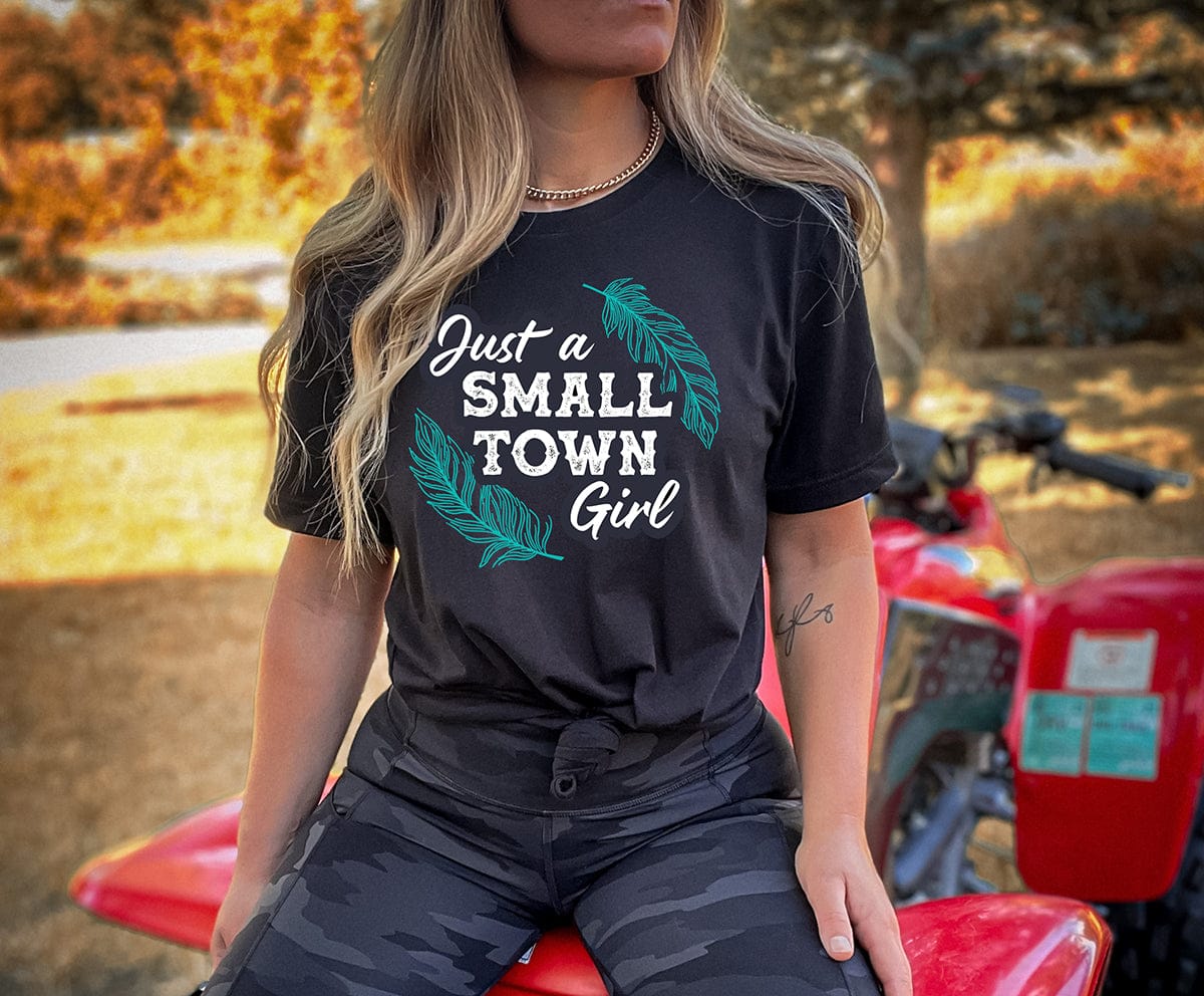Girl in Small Town Girl tee on ATV
