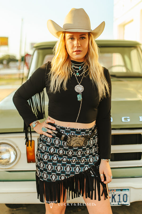 Woman in black top and patterned skirt, T0486-BLK
