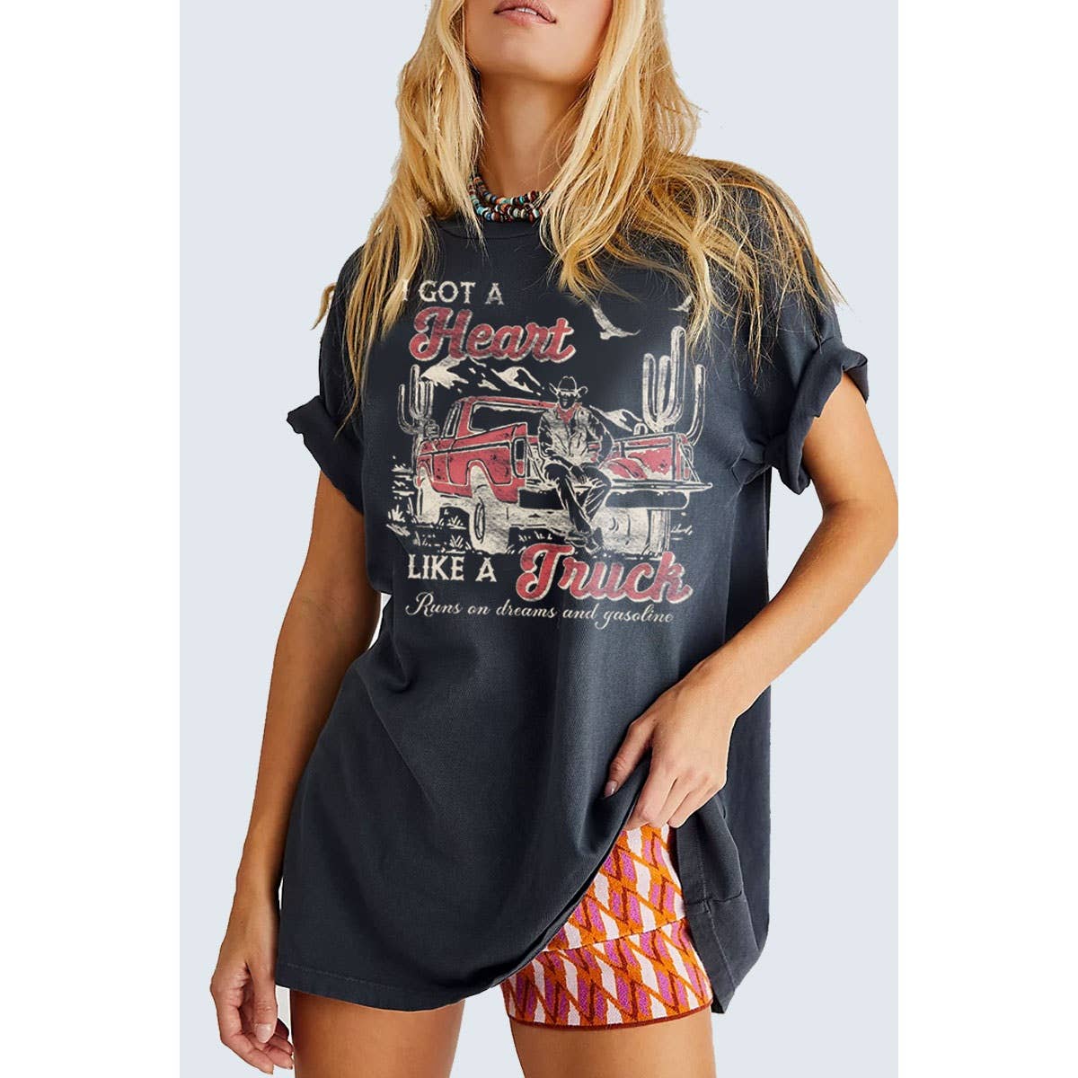 Woman wearing Got a Heart Like a Truck graphic tee