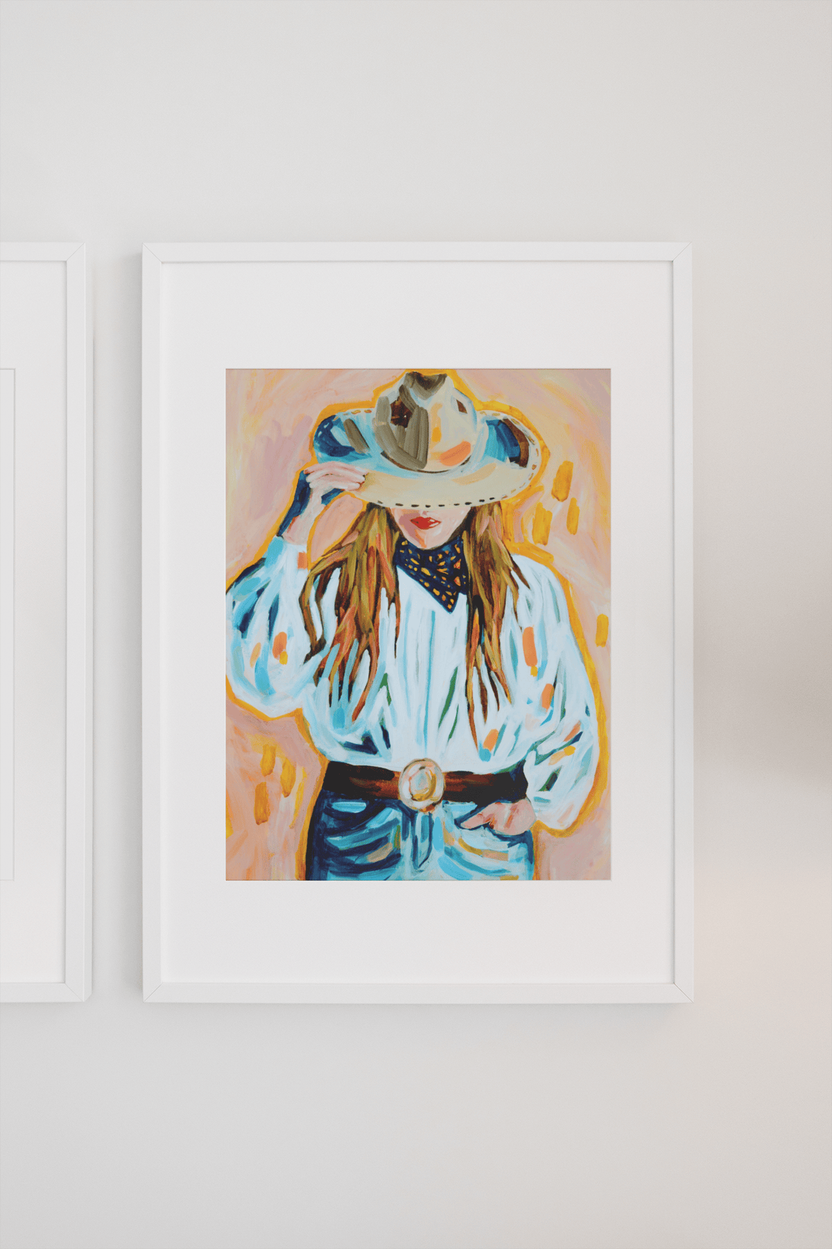 Painting of a woman in a cowboy hat and shirt, framed on a wall.