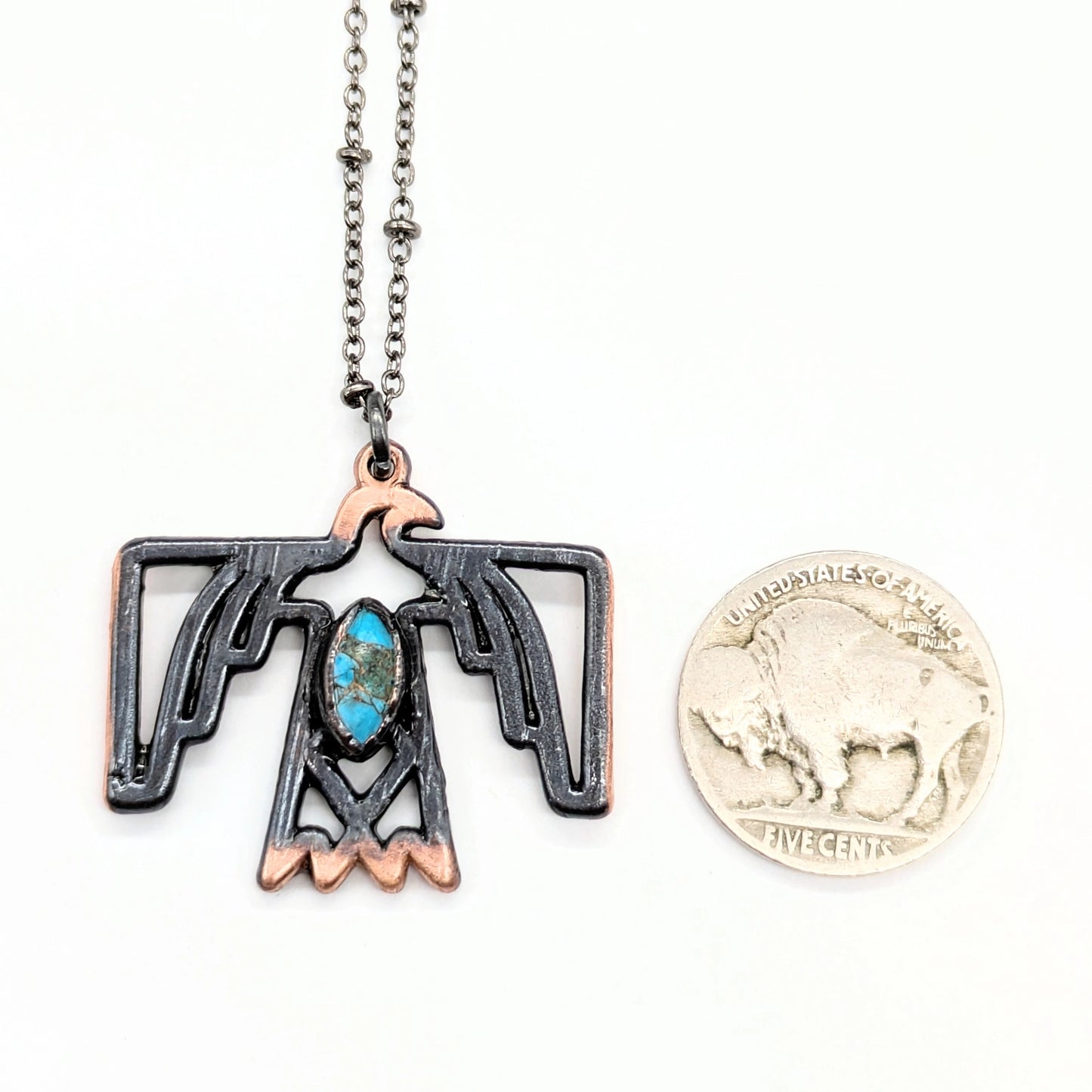 Thunderbird pendant necklace with turquoise and buffalo nickel.