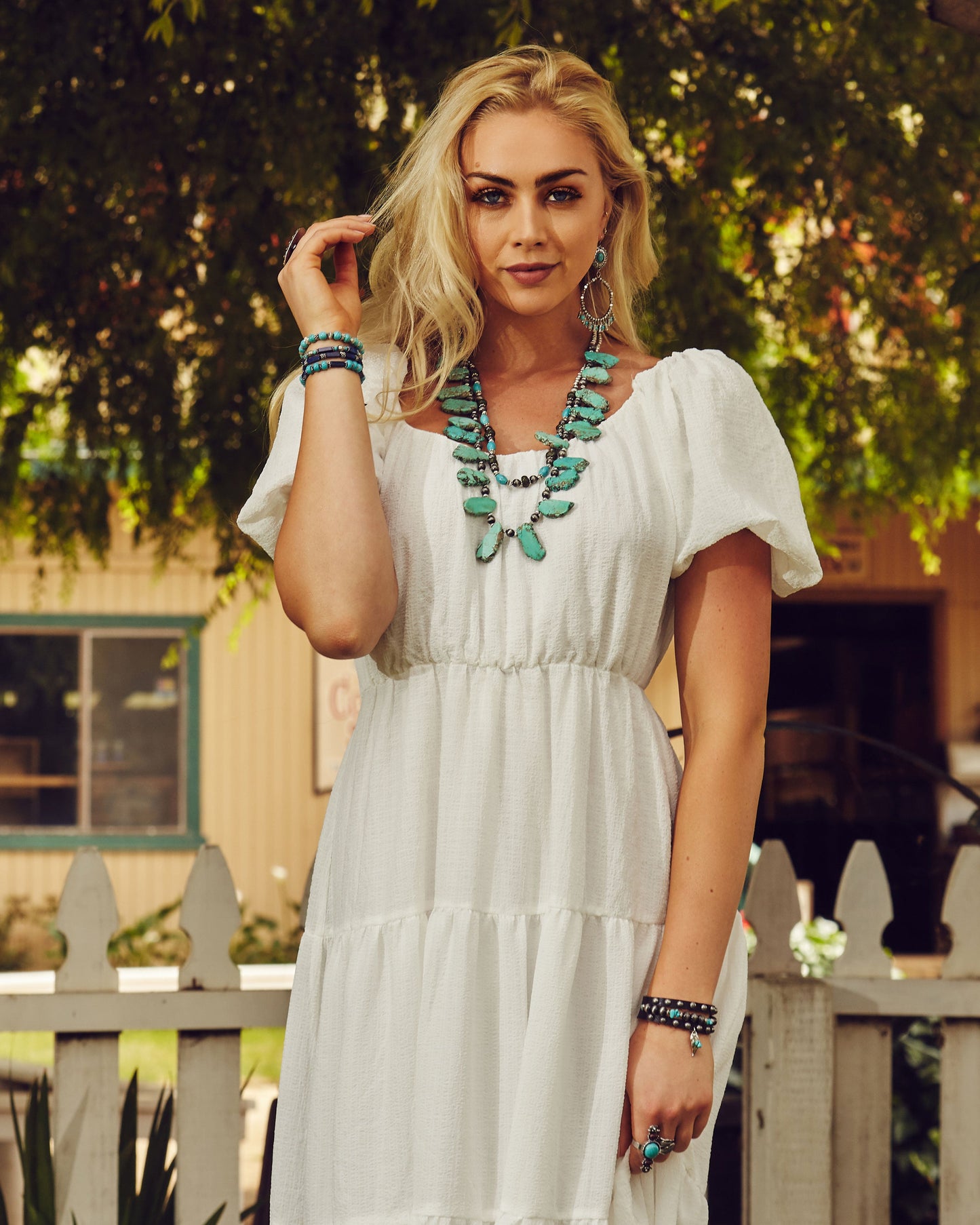 Woman in white dress and turquoise jewelry