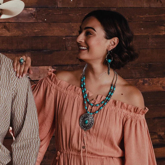 Woman wearing turquoise jewelry, lifestyle image