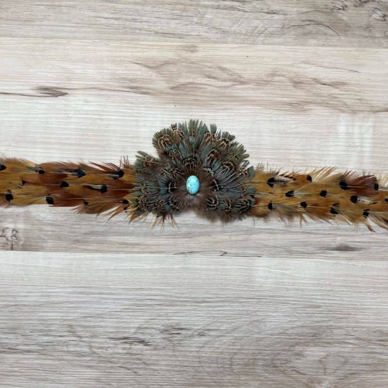 Feather headband with turquoise center stone.