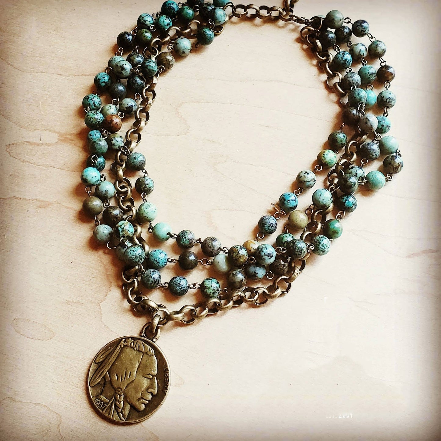 Layered turquoise bead necklace with pendant