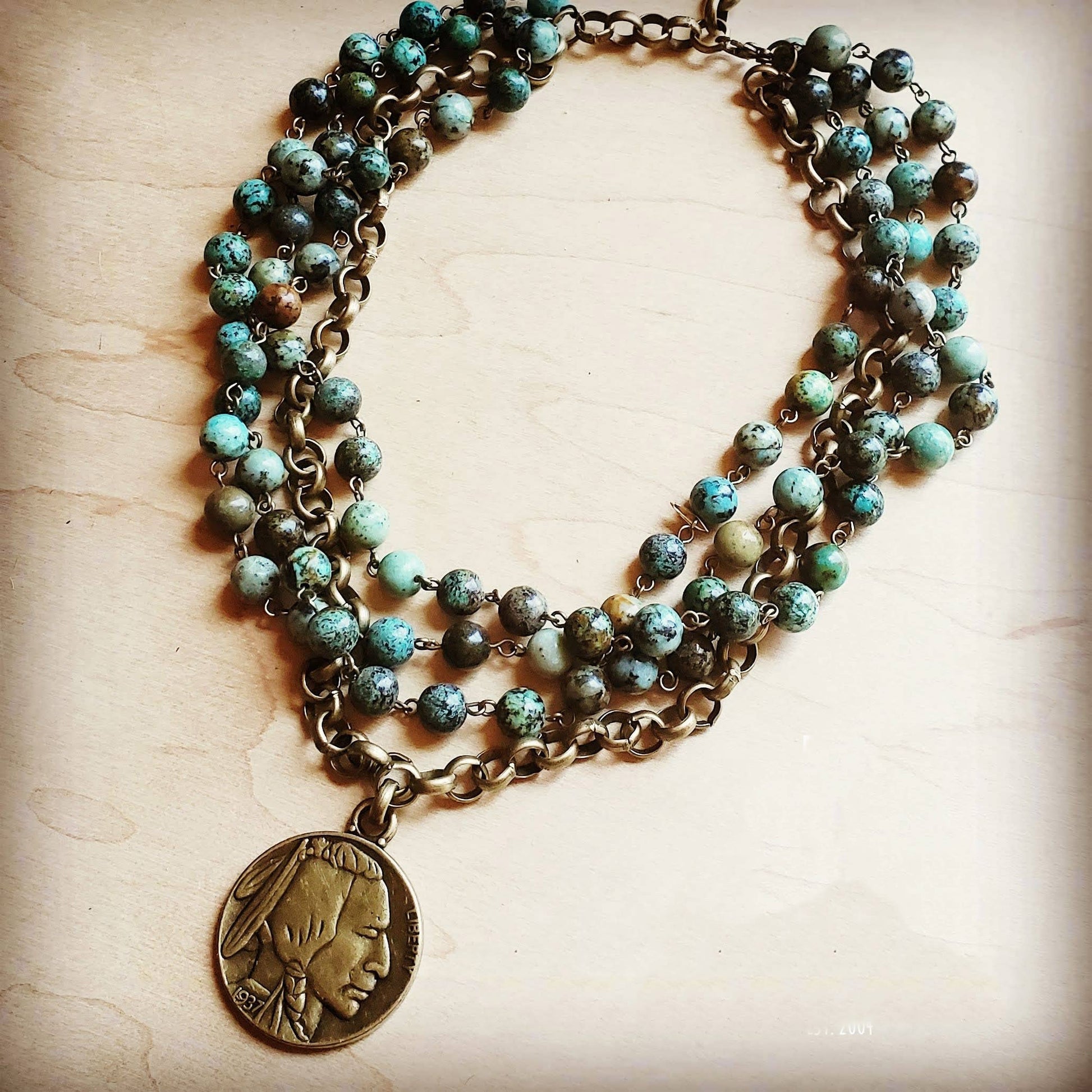 Layered turquoise bead necklace with pendant
