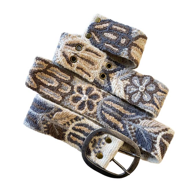 Embroidered patterned belt with buckle.