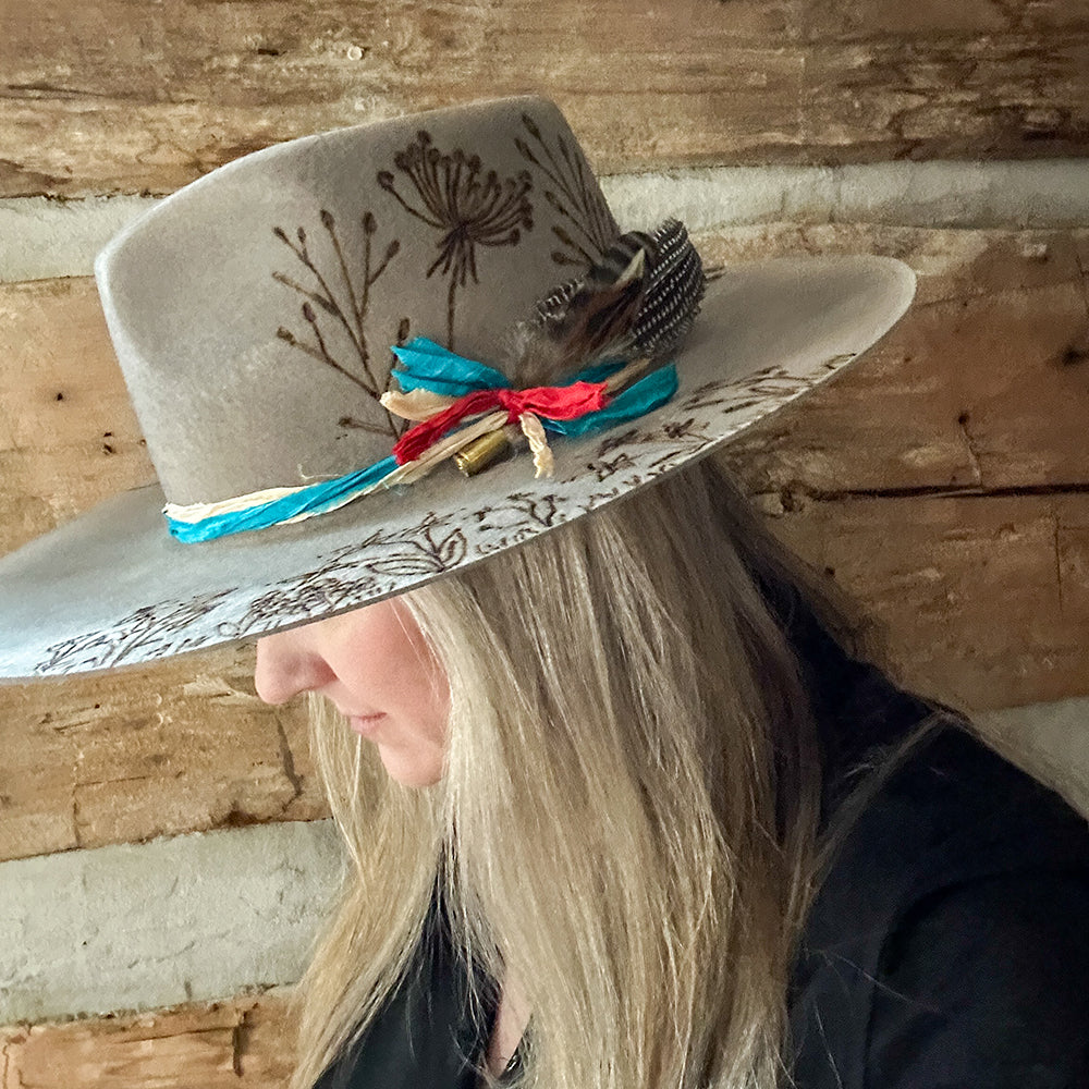 Gray hat with floral design and woman, grayhat2web