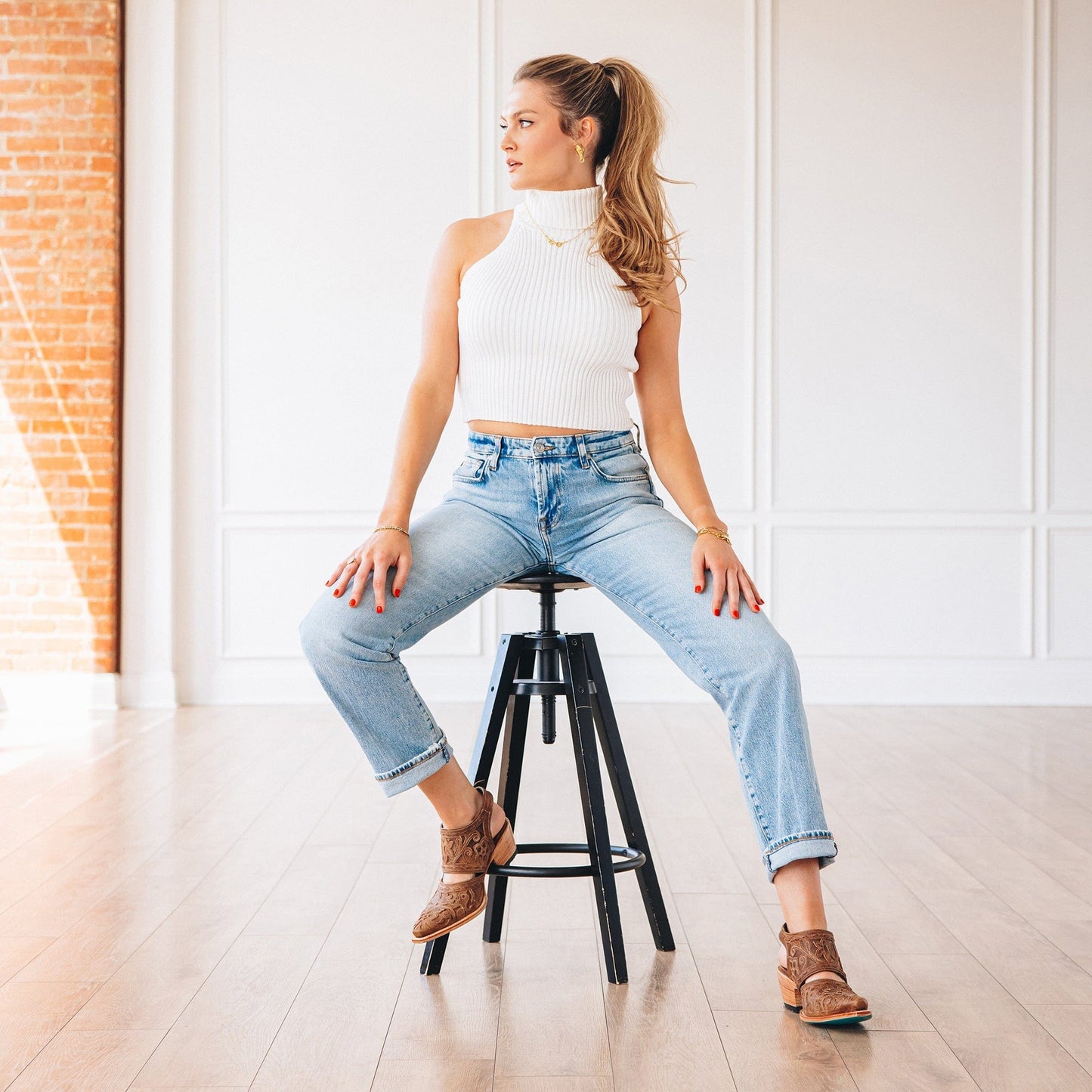Woman in desert clay slingback mules