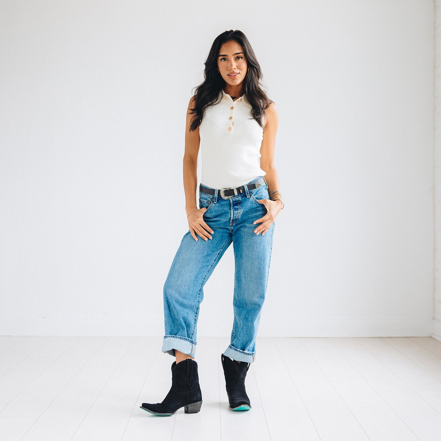 Woman wearing Emma Jane Booties, soft black suede.