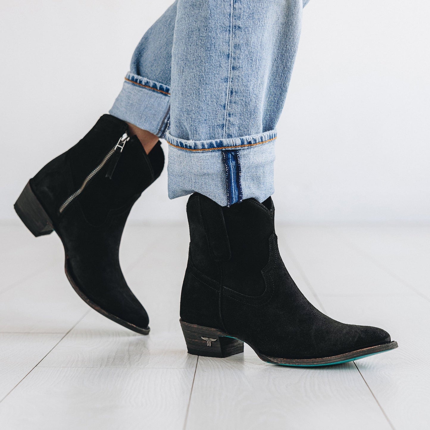 Black suede bootie with zipper detail