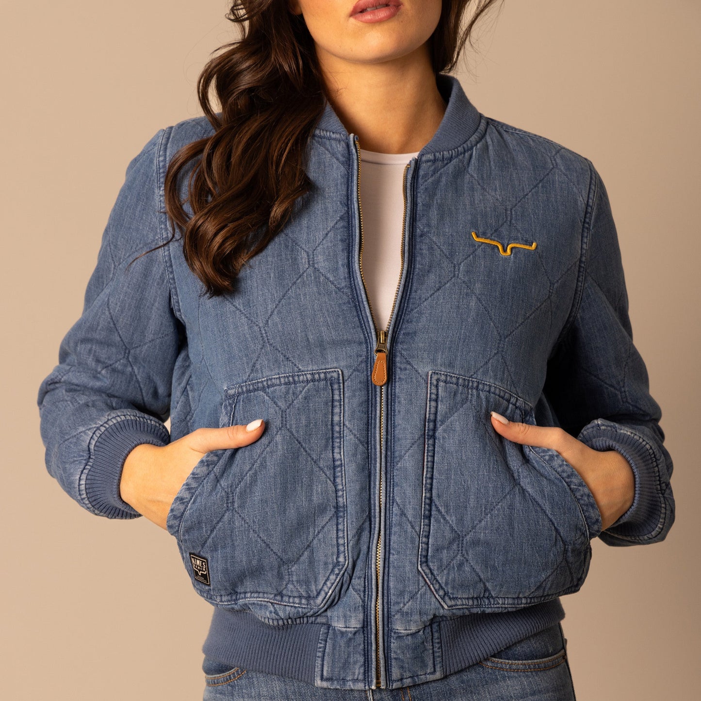 Woman wearing denim quilted jacket