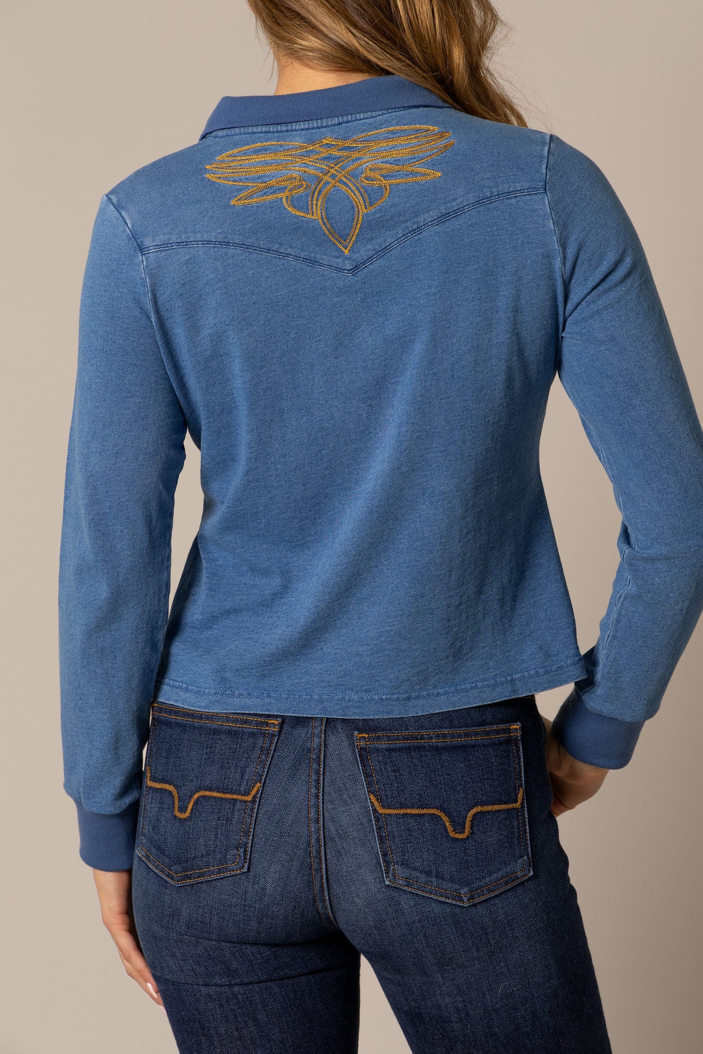 Woman in blue shirt with embroidered design, unnamed-196.