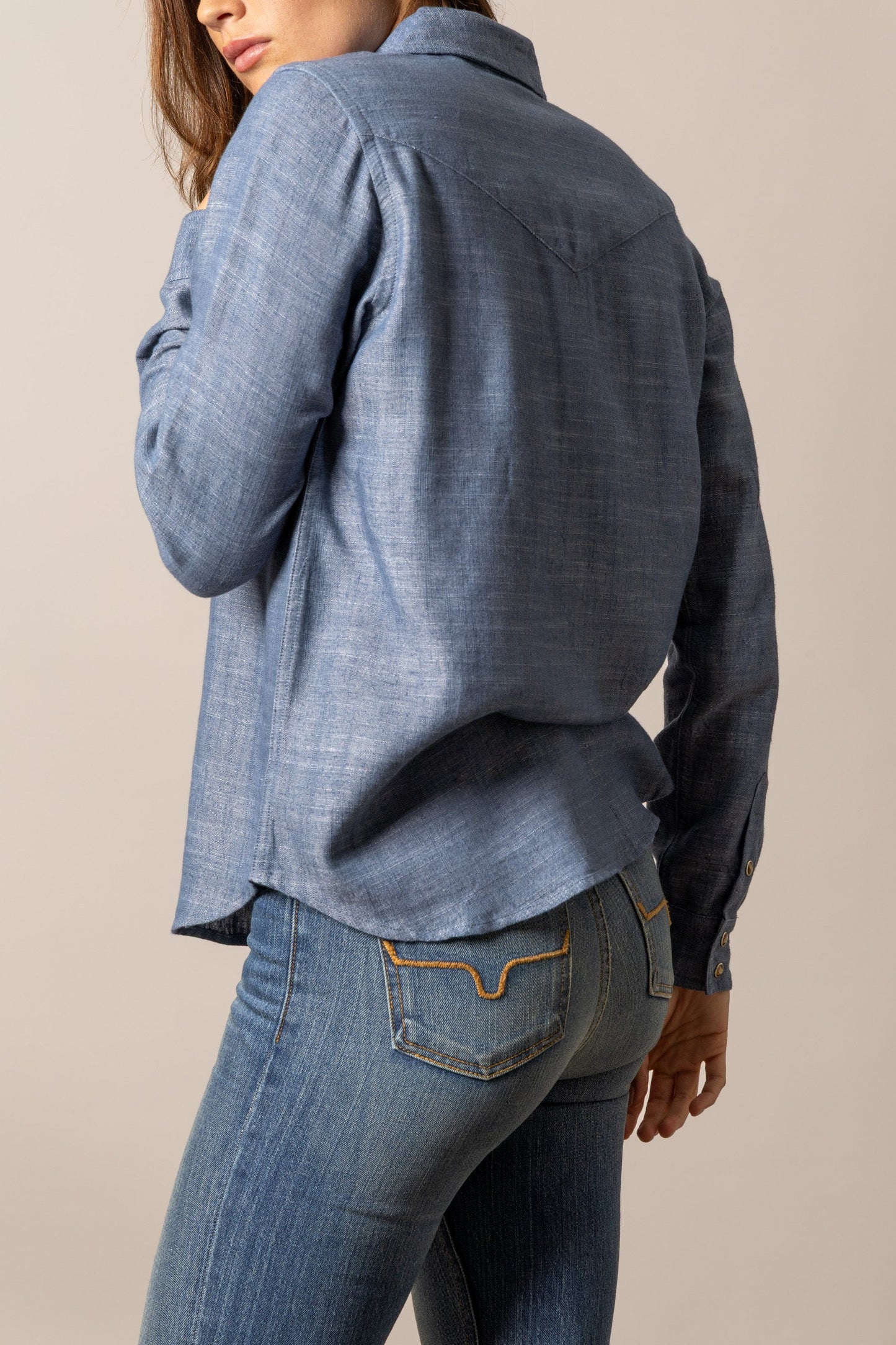 Woman in denim shirt and jeans