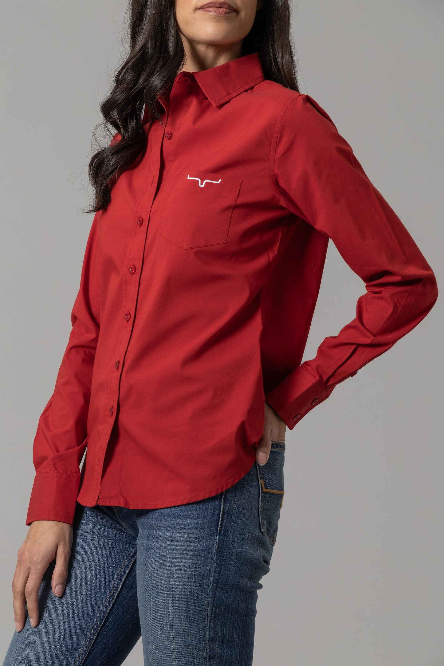 Red button-down shirt on woman