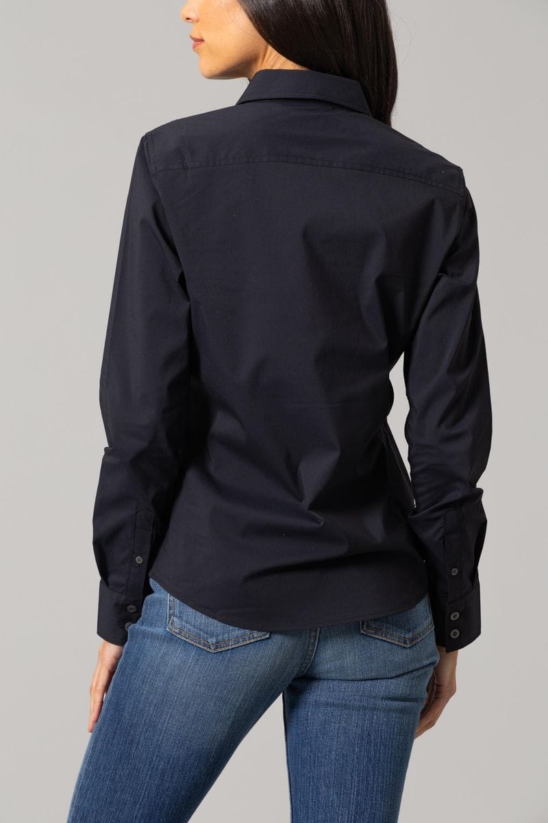 Woman in black button-down shirt and jeans