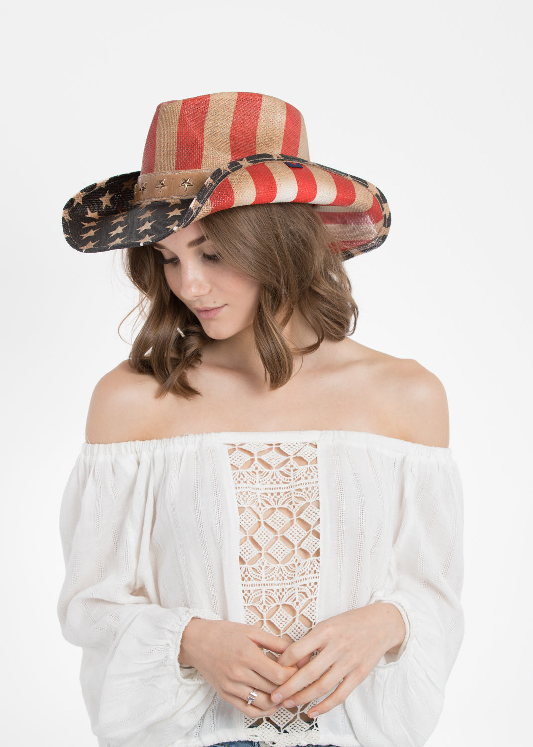 Woman wearing American flag cowboy hat