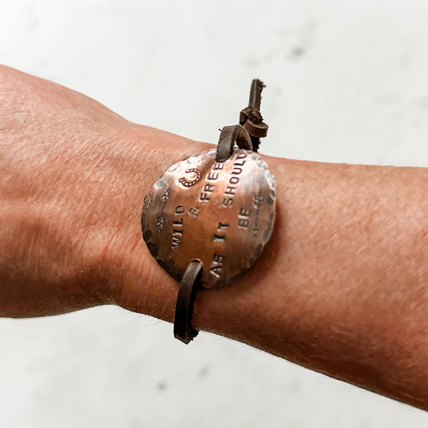 Wild & Free bracelet on wrist