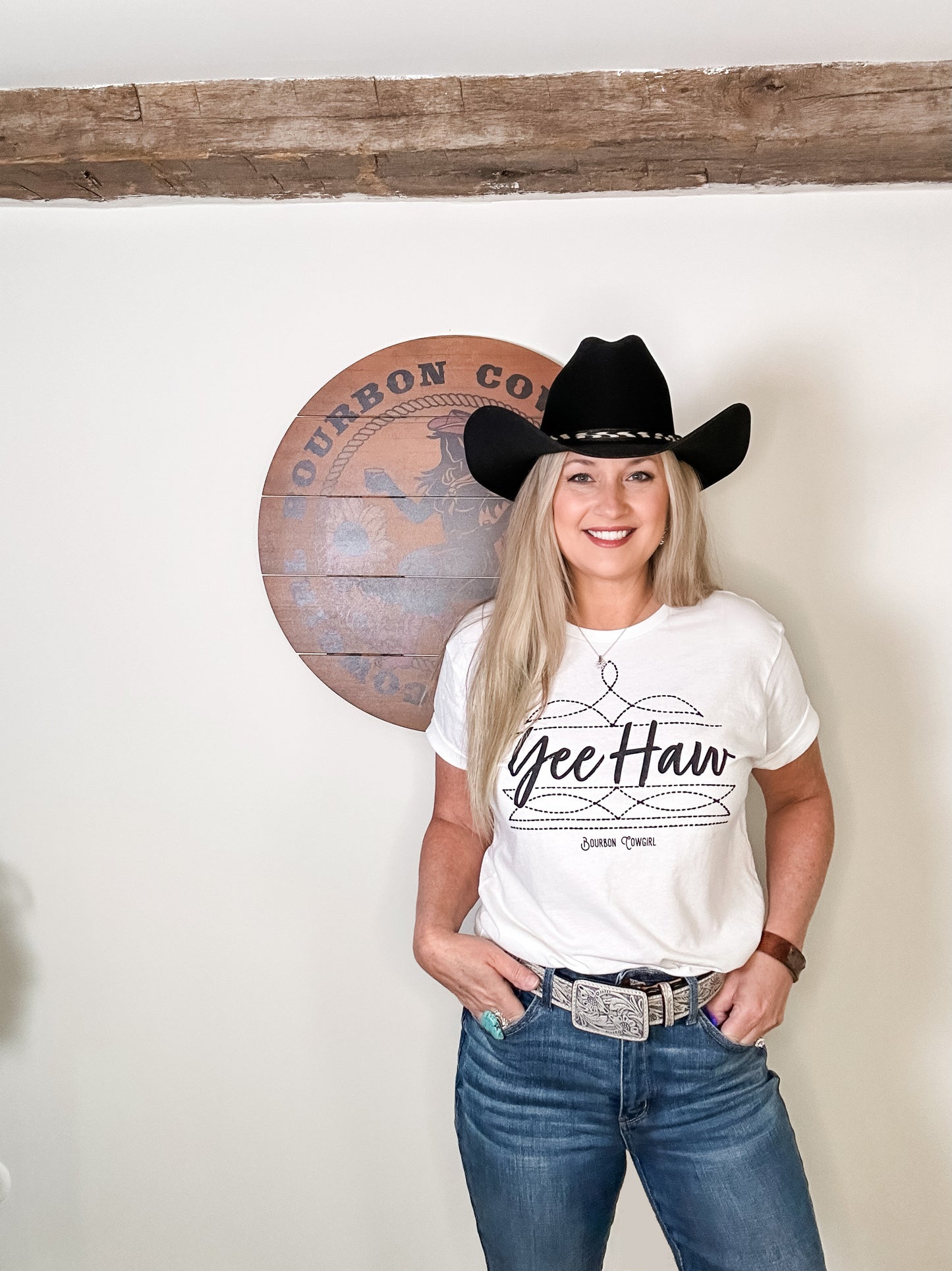 Woman in Yee Haw tee and cowboy hat