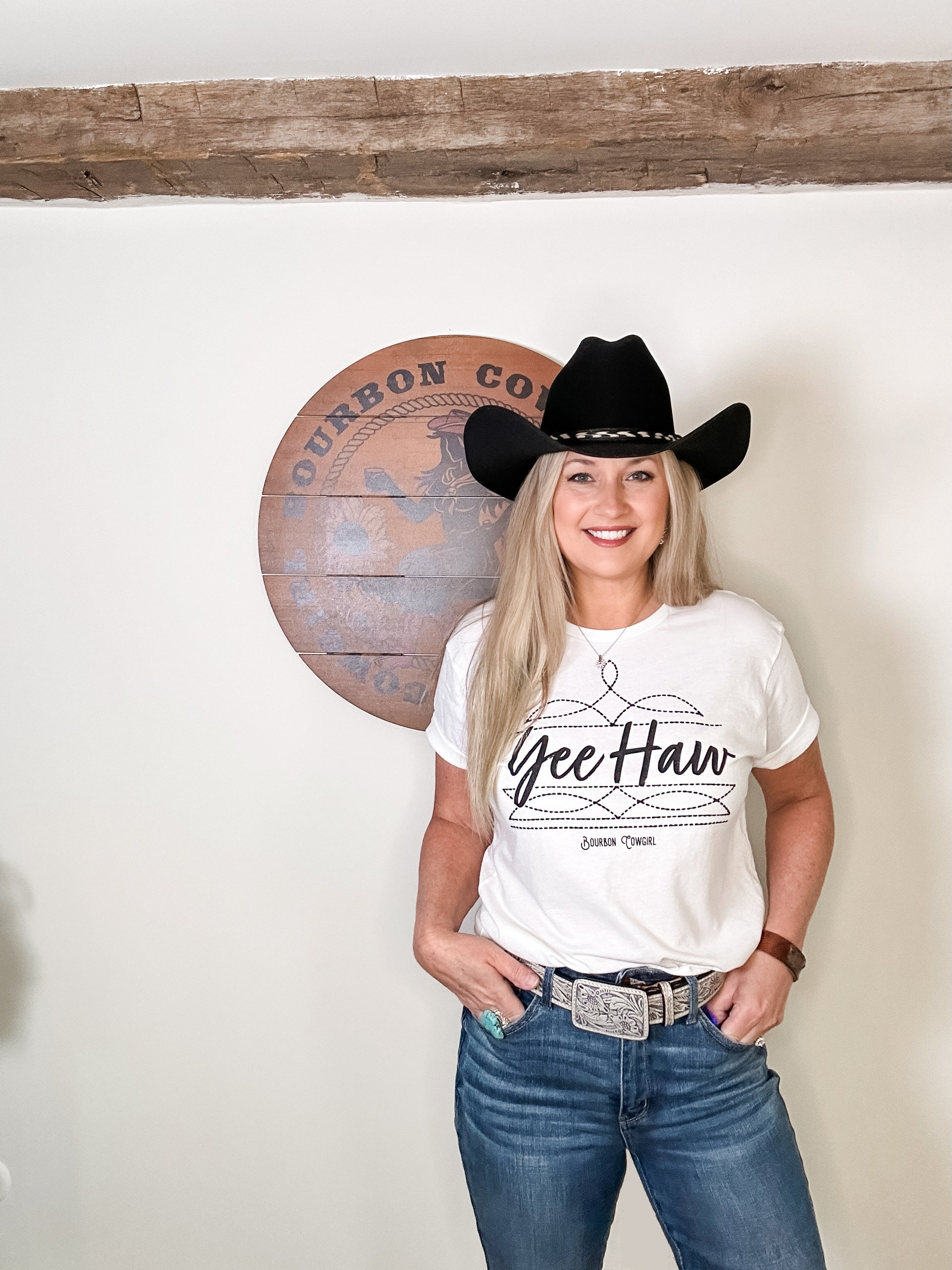 Woman in Yee Haw tee and cowboy hat