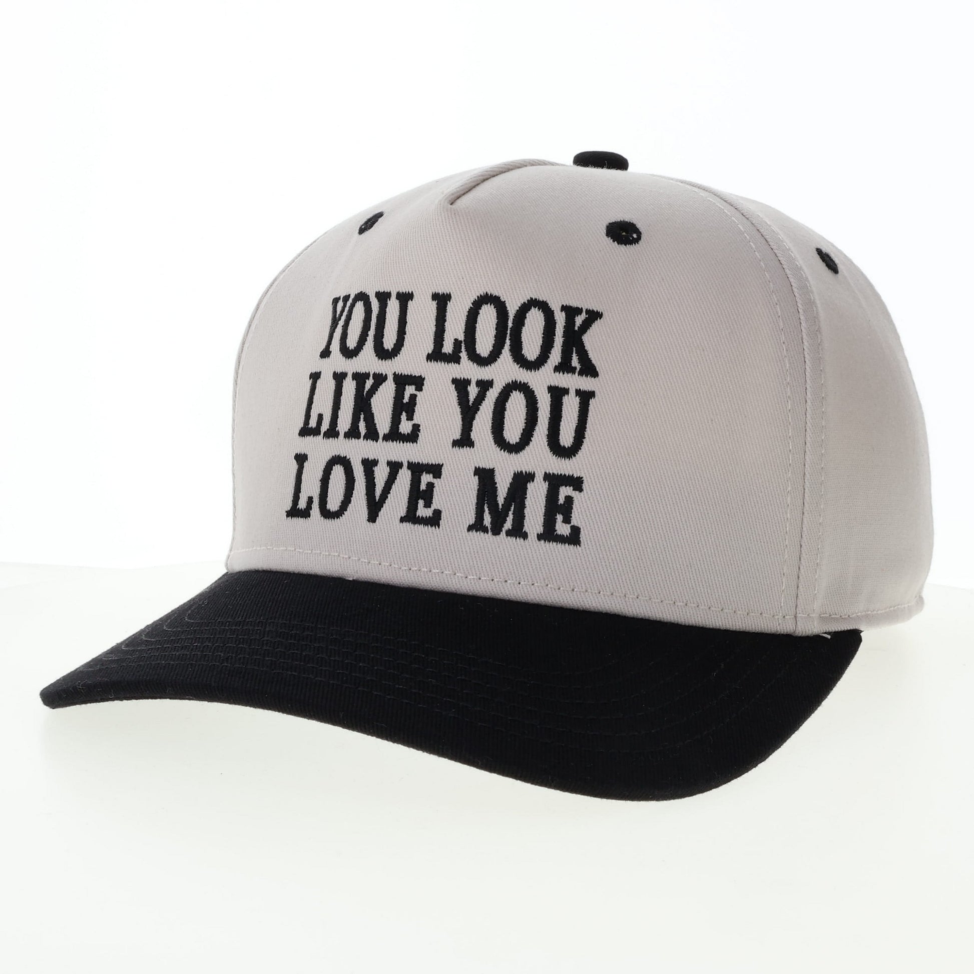 Baseball cap with You Look Like You Love Me text.