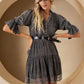 Woman in denim dress and hat