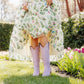 Woman in floral dress and lavender boots