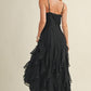 Woman in black ruffled dress.