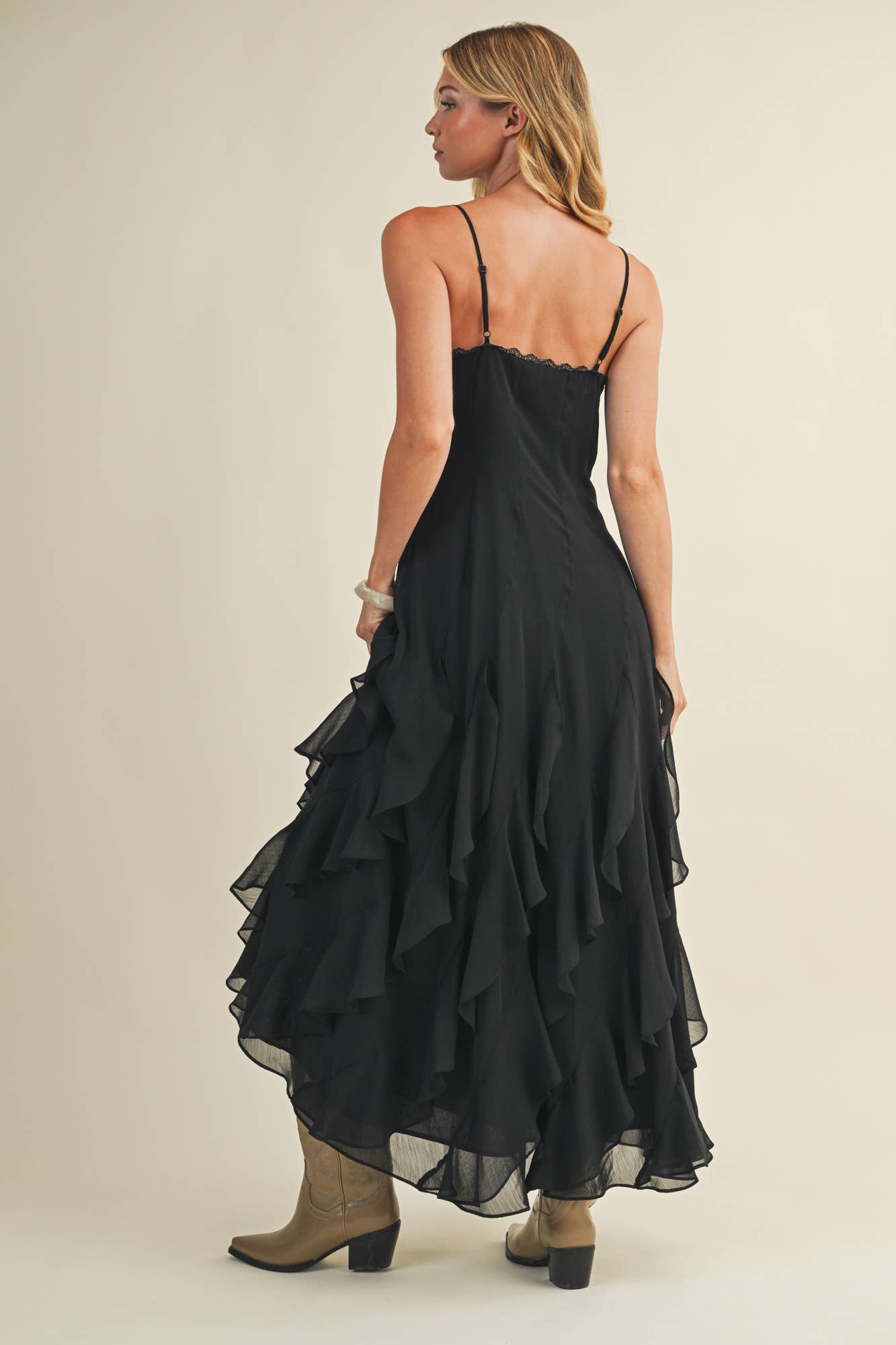 Woman in black ruffled dress.