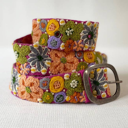 Embroidered floral belt with a metal buckle.