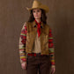 Woman wearing Sidekick Jacket, brown & patterned, with cowboy hat.