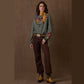 Diggers Sweatshirt with embroidered details, brown pants and boots.