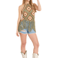Woman in crochet top, denim shorts, and cowboy boots