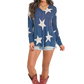Woman in star sweater and cowboy boots
