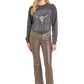 Woman in Rodeo shirt and leather pants