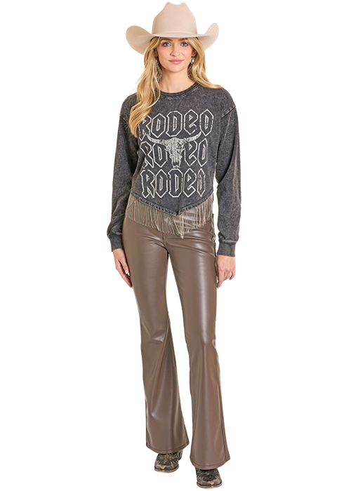 Woman in Rodeo shirt and leather pants