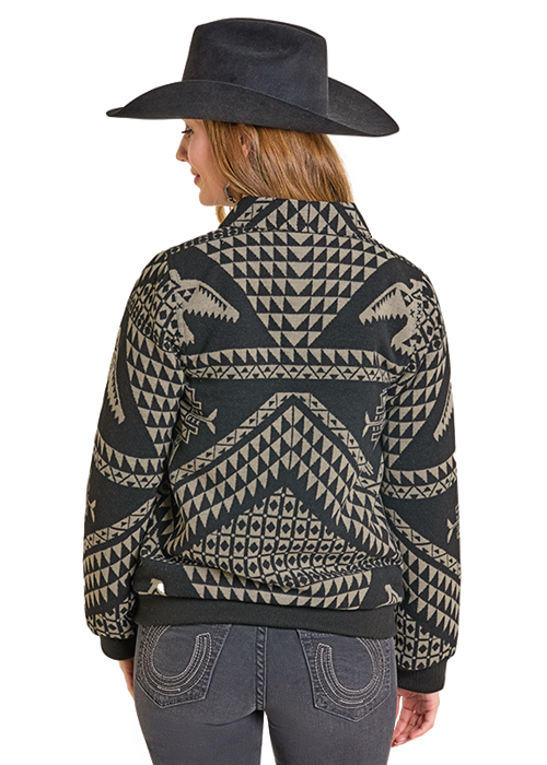 Woman wearing DW92C06830 patterned jacket and hat.