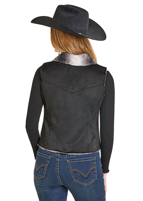 Cowgirl wearing black vest and hat