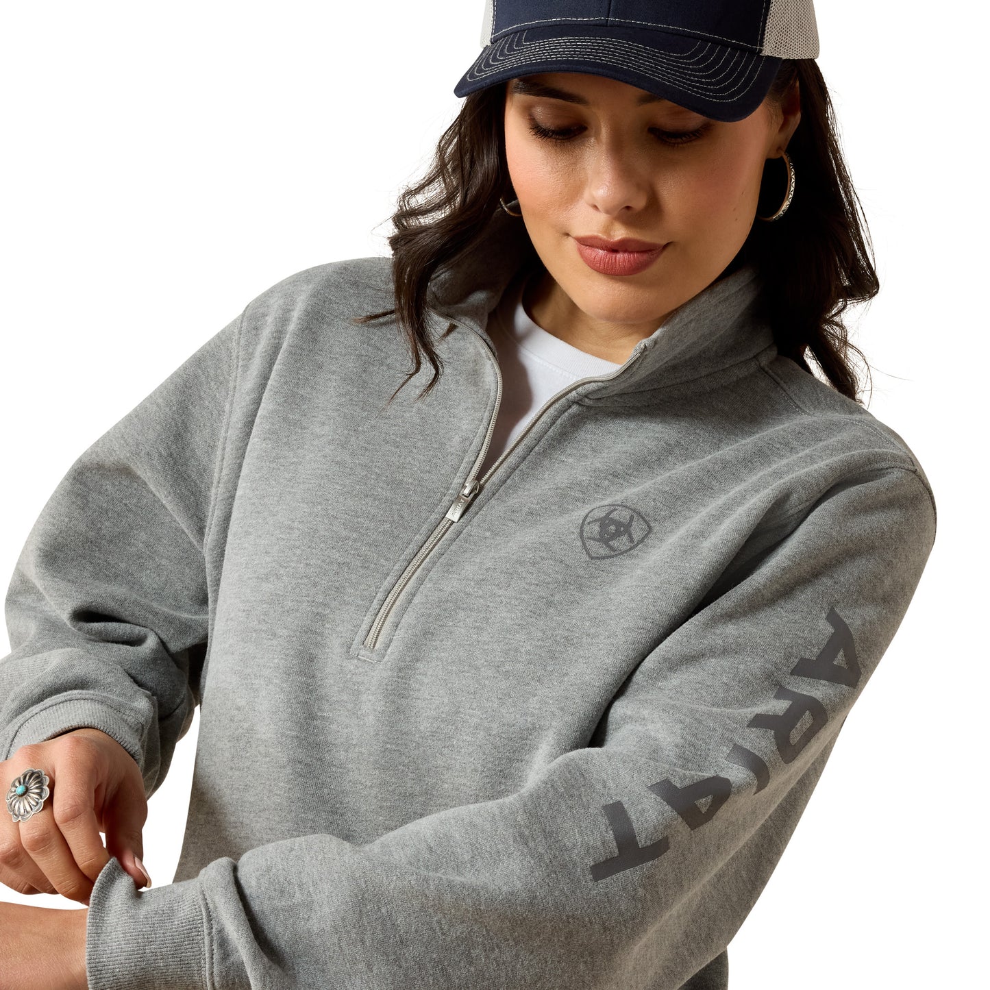 Woman in gray zip-up sweatshirt