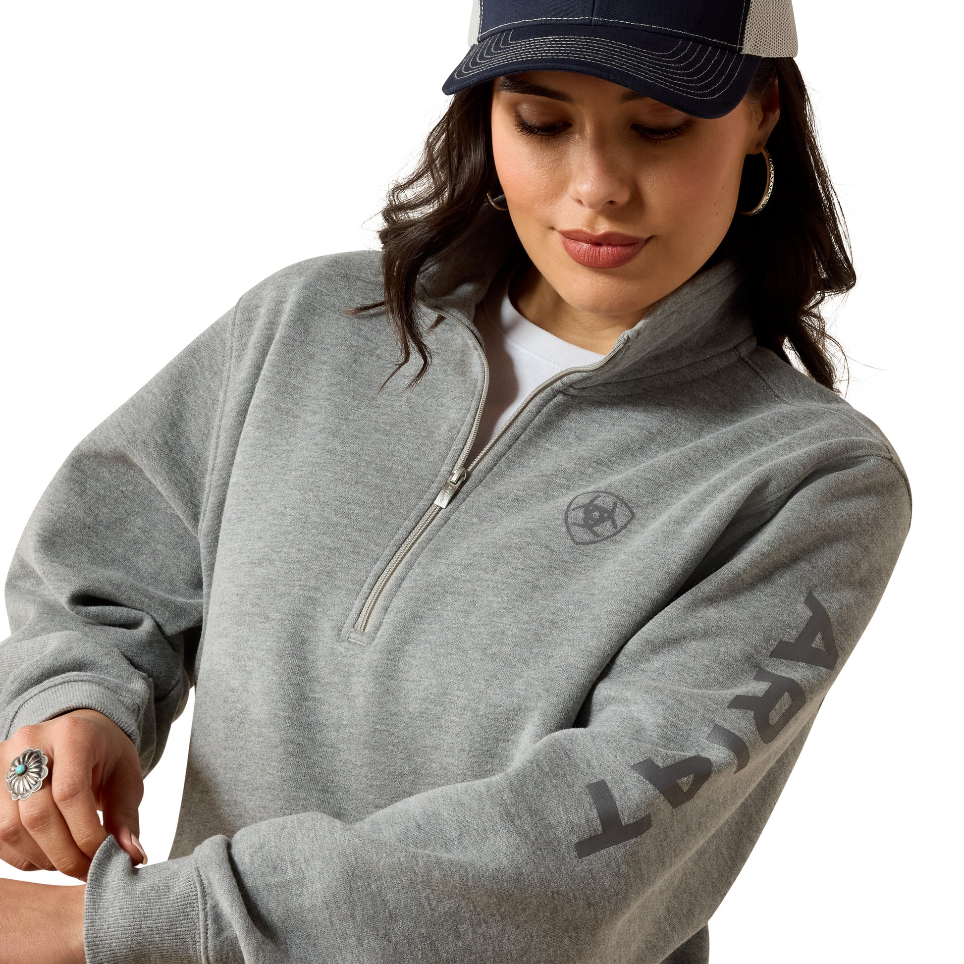 Woman in gray zip-up sweatshirt